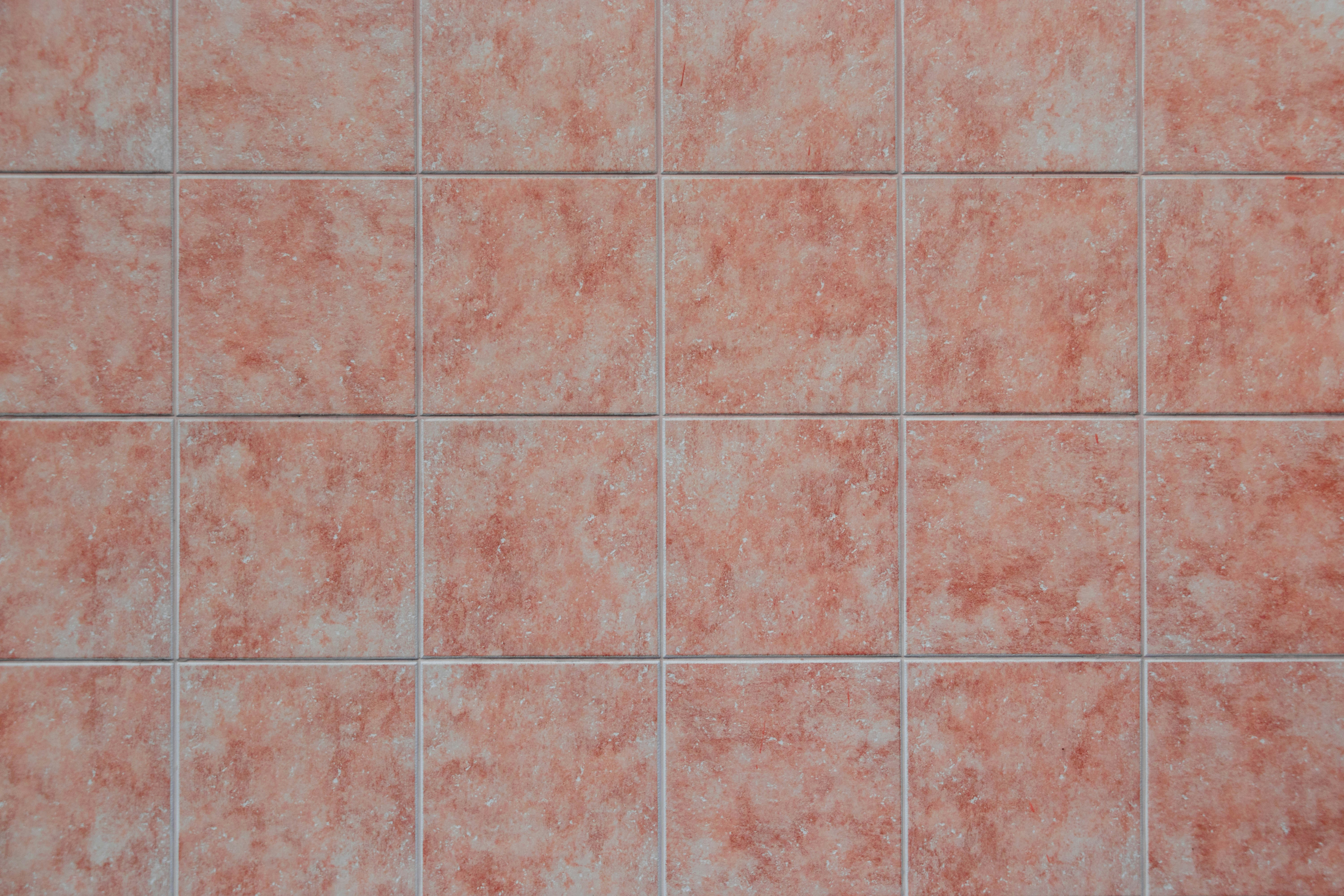 Coloured tiles with grout requiring maintenance